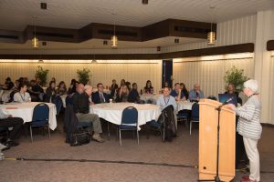 Associate Dean of Research, Dr. Penny Moody-Corbett at podium 