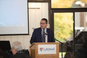 Don Rusnak, Member of Parliment, Thunder Bay-Rainy River, at podium 