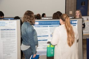 students viewing poster presentations at 2017 NHRC