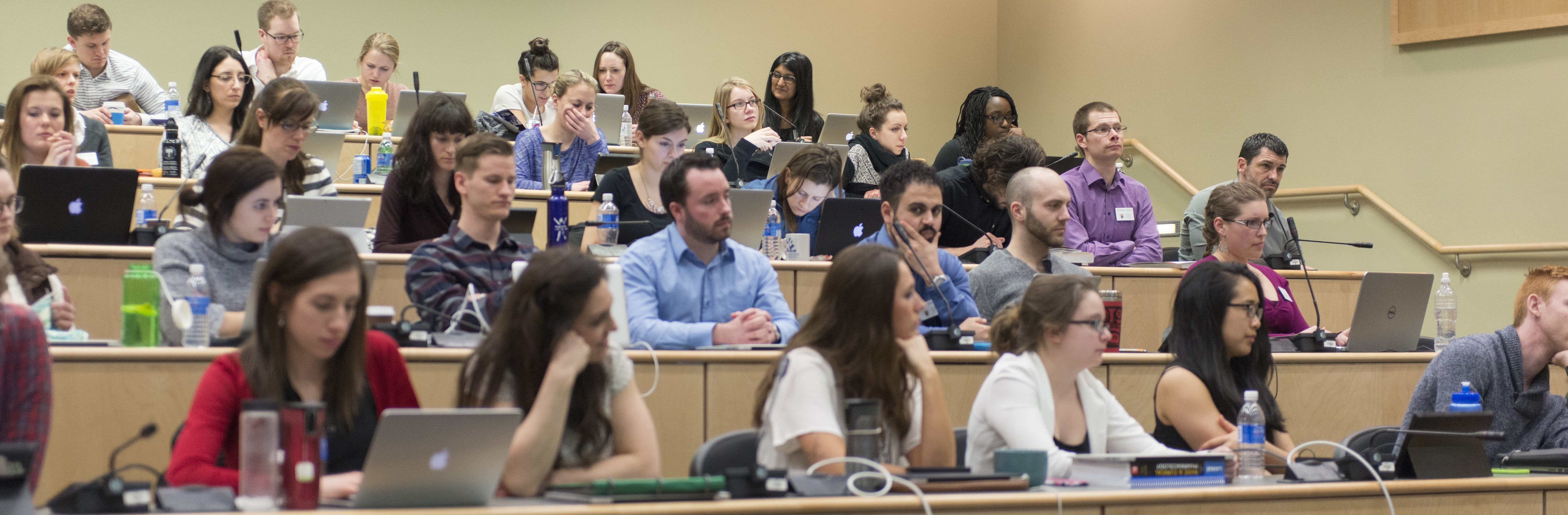 Photo of medical students sitting in lecture style classroom