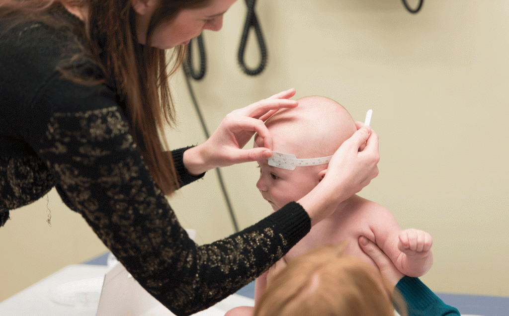 Northern Ontario Dietetic Internship Program student measuring a baby's head circumference.