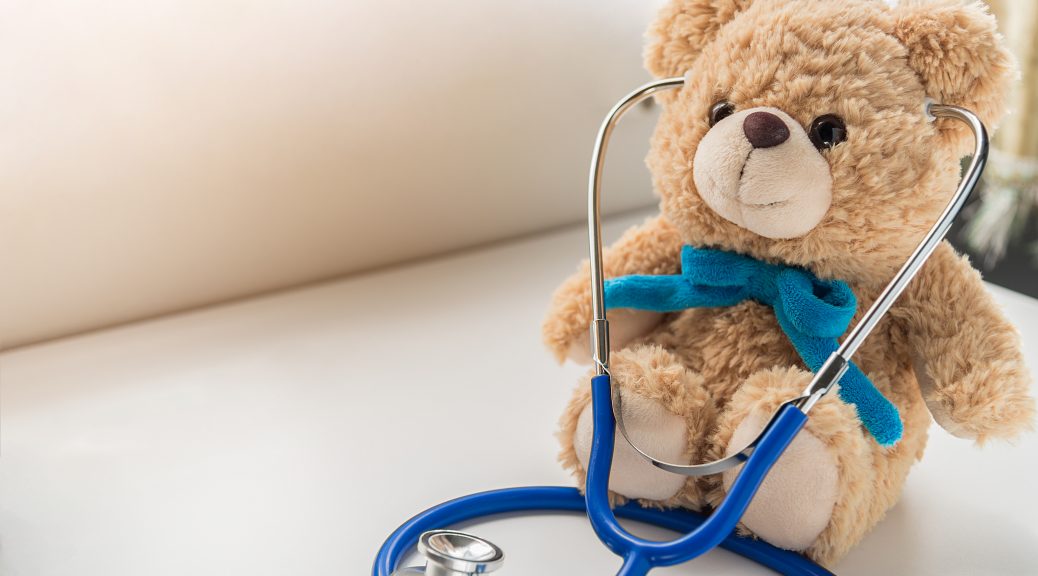 Children doctor concept - Teddy Bear with stethoscope