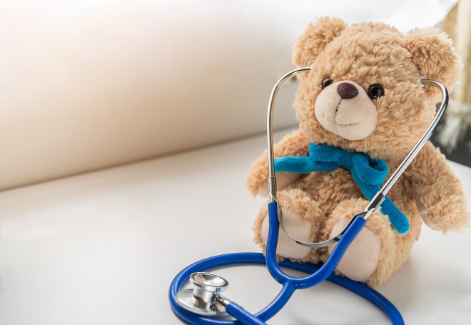 Children doctor concept - Teddy Bear with stethoscope