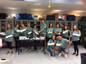 Group photo of campers displaying casted arms