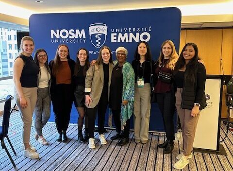 Dr. Sarita Verma surrounded by NOSM University MD students.