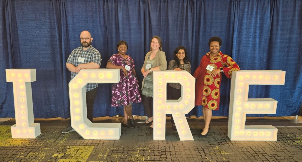 5 PHPM residents standing behind big letters that spell ICRE 