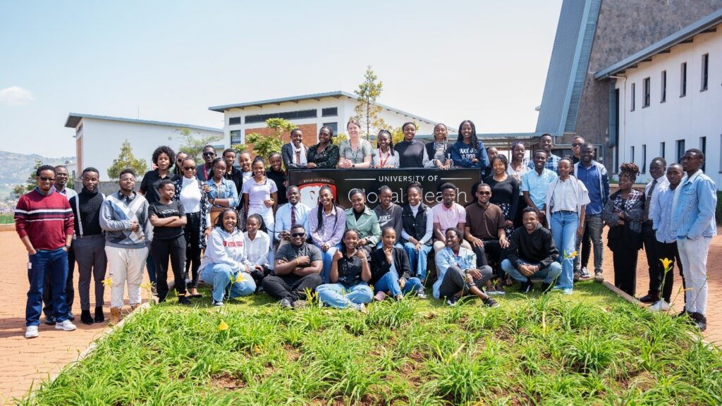students in front of University of Global Health Equity sign 